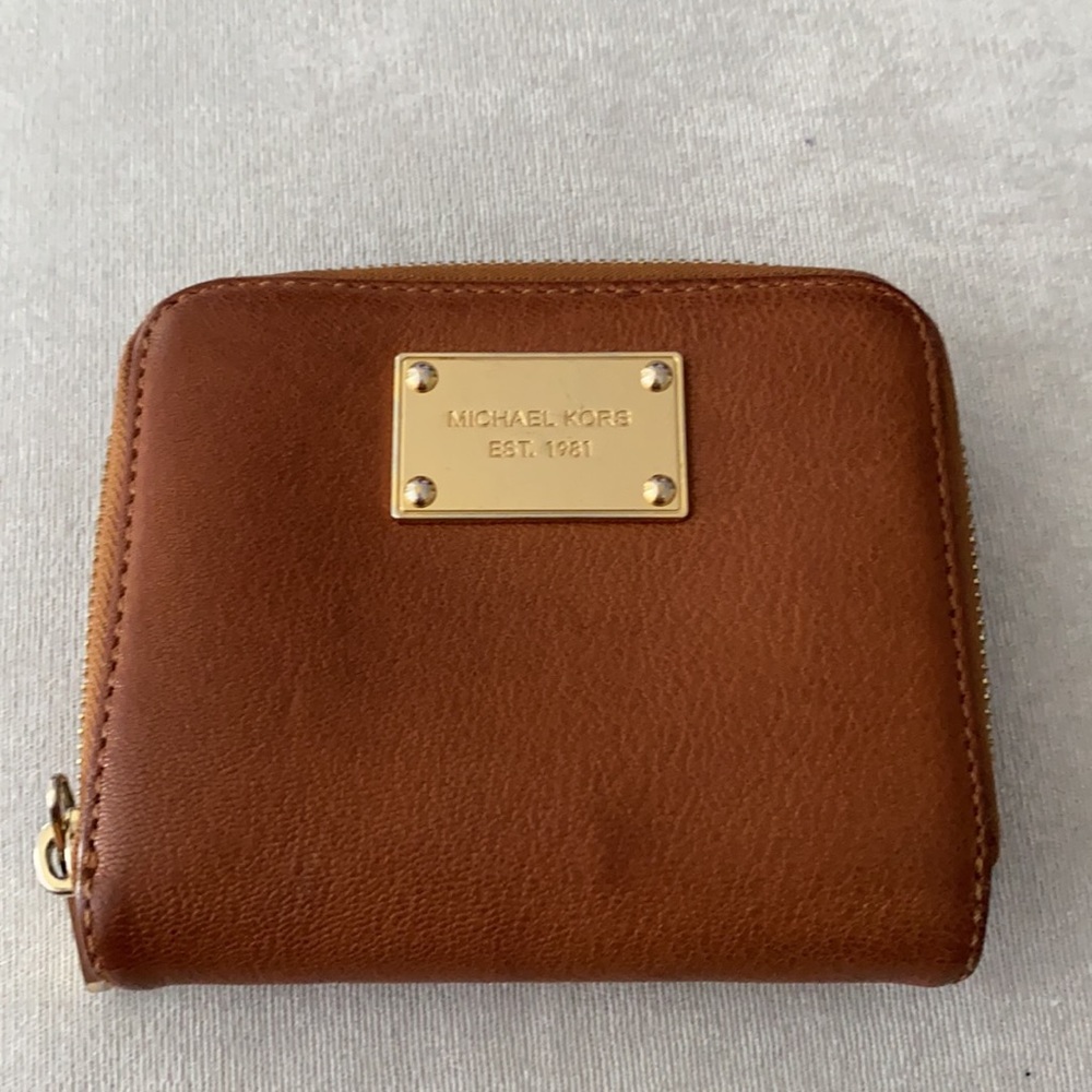 Michael Kors wallet with gold detail and z…